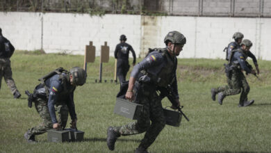 A Colombian special operations team carries weighted ammo cans during an assaulter stage of Fuerzas Comando 2025 at Ilopango, El Salvador, Aug. 23, 2025. Fuerzas Comando 2025 brings together 16 special operations team from across Central, South America and the Caribbean to test skills through a 10-day special operations forces competition alongside a senior leadership seminar to collectively refine skills and foster military-to-military relationships. (U.S. Army National Guard photo by Sgt. Hassani Ribera)
