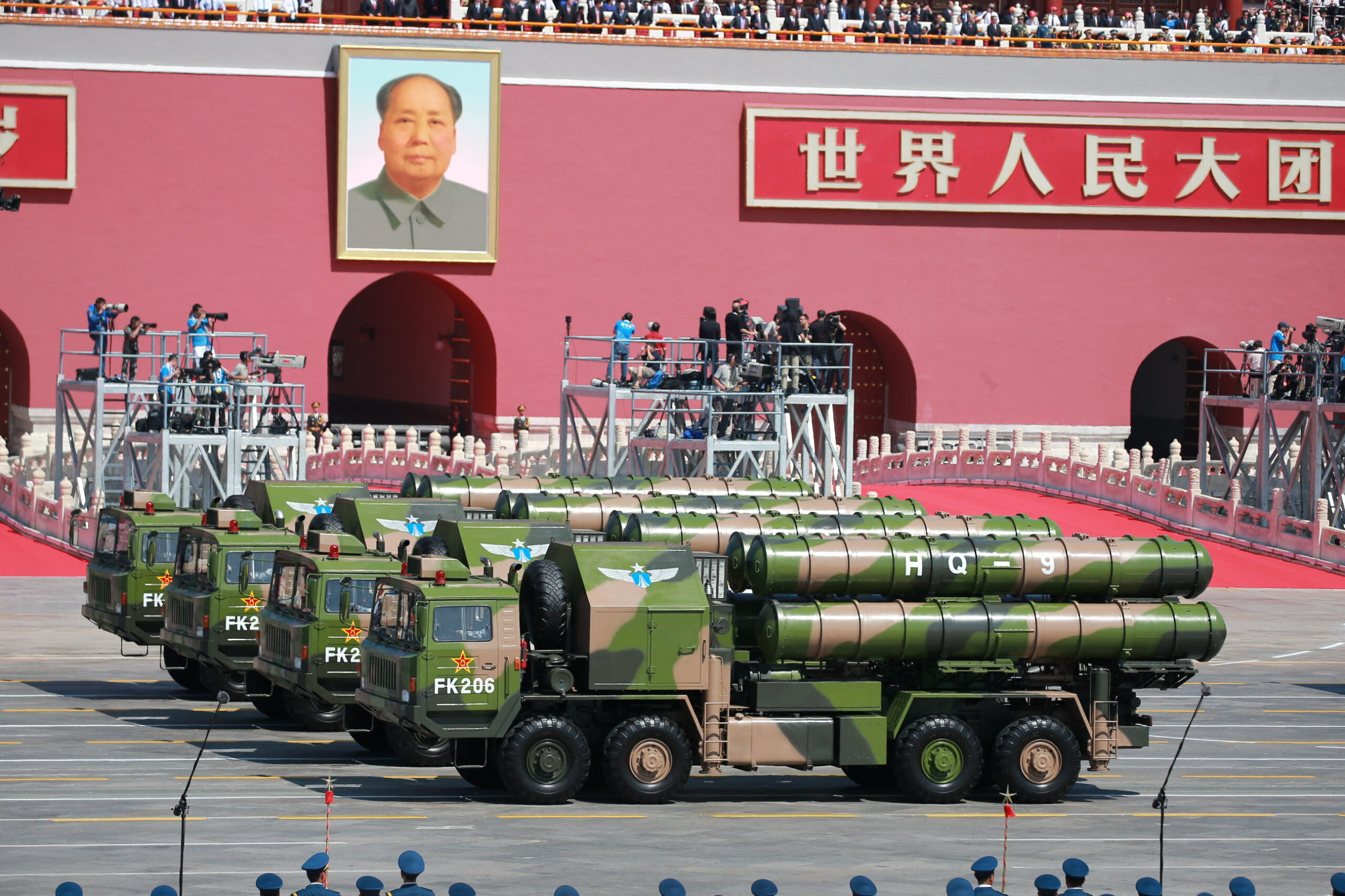 Military vehicles carrying HQ-9 medium- to long-range surface-to-air missiles march past the Tiananmen Rostrum during the military parade to commemorate the 70th anniversary of the victory in the Chinese People's War of Resistance Against Japanese Aggression in Beijing, China, 3 September 2015. China has pledged to cut the number of troops in its army by 300,000, in an unexpected announcement made by Chinese president Xi Jinping on Thursday (3 September 2015). Xi disclosed the news during a speech made before the beginning of a huge military parade in Beijing's Tiananmen Square, held to mark the end of World War II and celebrate China's victory over Japan. Xi said that a 13% cut would be made in the country's 2.3 million-armed forces, stressing that China was committed to peace, although he gave no indication of when it would be implemented. "War is like a mirror," he said. "Looking at it helps us better understand the value of peace. China will remain committed to peaceful development. We Chinese love peace." China has cut the size of its military three times since the 1980s, according to media reports. (Photo by Ge jinfh / Imaginechina via AFP)