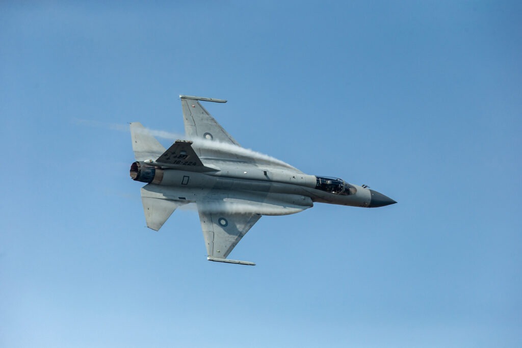 Pakistani Air Force's JF-17 Thunder (FC-1 Xiaolong or FC-1 Fierce Dragon) fighter jet performs during the 12th China International Aviation and Aerospace Exhibition, also known as Airshow China 2018, in Zhuhai city, south China's Guangdong province, 9 November 2018. JF-17 Thunder exhibited its dazzling aerial performance in front of the delegations of various air forces and aviation industries on the third day of Zhuhai Air Show in China. The breathtaking aerial display by the seasoned aerobatics pilot wing commander Zeeshan Baryar included some stunning maneuvers like the muscle climb, thunder turns, slow speed pass and inverted flight. An over fifteen minutes jaw dropping performance by Pride of The Nation, JF-17 Thunder, concluded with the trademark vertical rolls and disappearing in the blue skies of Zhuhai, leaving behind hundreds of spellbound spectators. The mesmerized audience applauded the Thundery performance as it landed back. (Photo by Shu ying / Imaginechina via AFP)