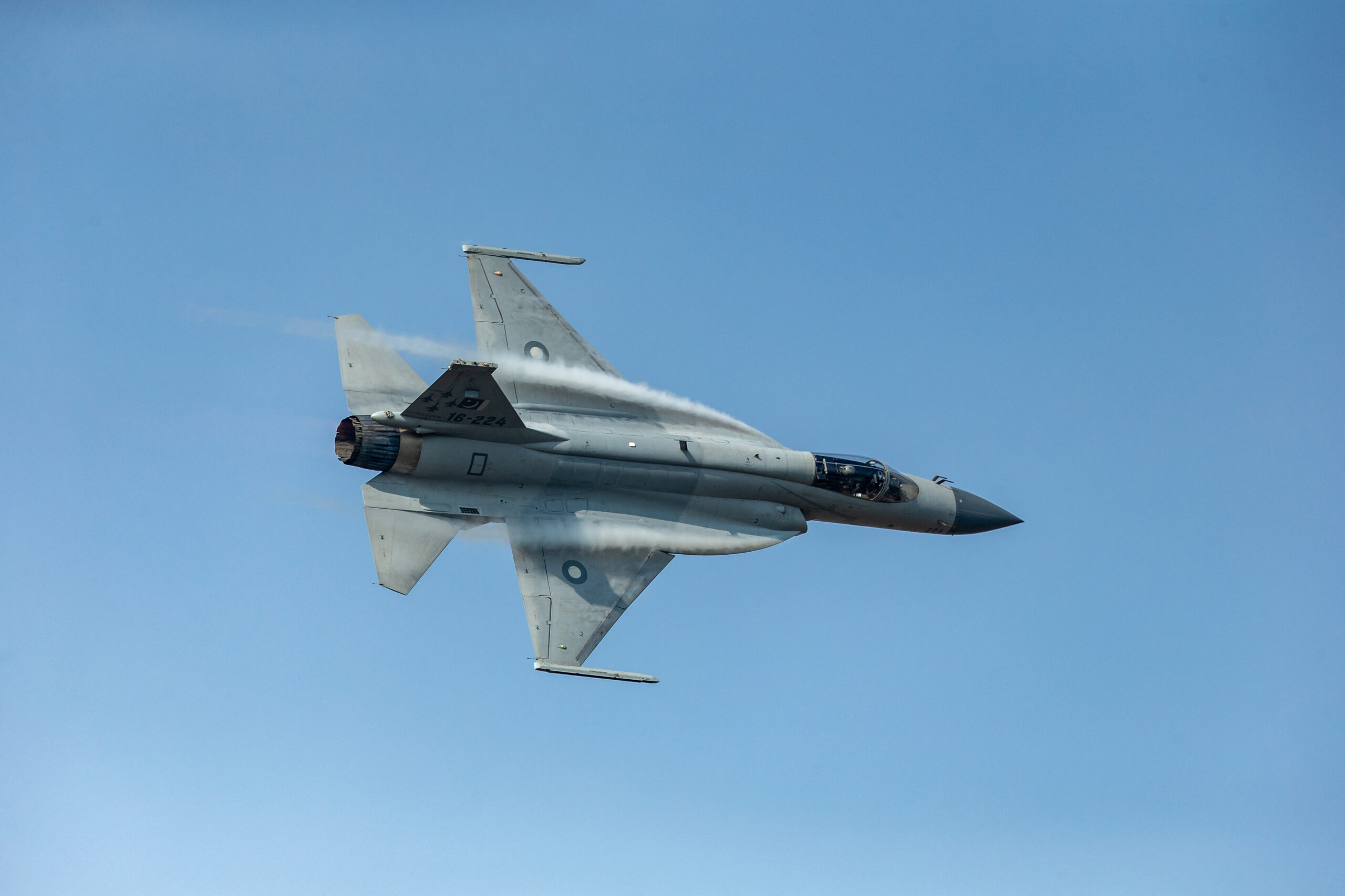 Pakistani Air Force's JF-17 Thunder (FC-1 Xiaolong or FC-1 Fierce Dragon) fighter jet performs during the 12th China International Aviation and Aerospace Exhibition, also known as Airshow China 2018, in Zhuhai city, south China's Guangdong province, 9 November 2018. JF-17 Thunder exhibited its dazzling aerial performance in front of the delegations of various air forces and aviation industries on the third day of Zhuhai Air Show in China. The breathtaking aerial display by the seasoned aerobatics pilot wing commander Zeeshan Baryar included some stunning maneuvers like the muscle climb, thunder turns, slow speed pass and inverted flight. An over fifteen minutes jaw dropping performance by Pride of The Nation, JF-17 Thunder, concluded with the trademark vertical rolls and disappearing in the blue skies of Zhuhai, leaving behind hundreds of spellbound spectators. The mesmerized audience applauded the Thundery performance as it landed back. (Photo by Shu ying / Imaginechina via AFP)