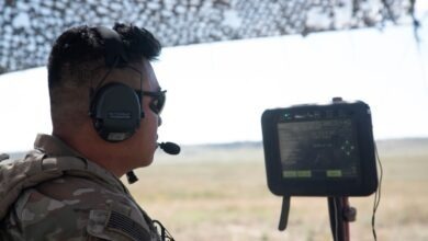 Spc. Anthony Tran, assigned to Charlie Battery, 2nd Battalion, 77th Field Artillery Regiment, Division Artillery, 4th Infantry Division, inspects the new fire control system for the M777 howitzer during Ivy Sting 1 on Fort Carson, Colo., Sept. 16, 2025.