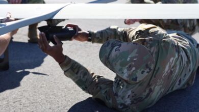 Army Sgt. Joshua Capers, assigned to the 1st Aviation Brigade of the Army Aviation Center of Excellence, attaches a payload to the VXE30 Stalker during training with an uncrewed aircraft system at Fort Rucker, Ala., Nov. 18, 2025.