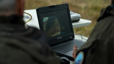 Operators sending the reconnaissance drone to map the area.