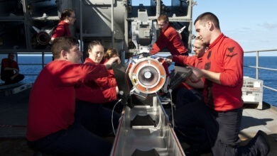 Sailors aboard the Nimitz-class aircraft carrier USS John C. Stennis remove a RIM-7 Sea Sparrow missile from a NATO Sea Sparrow Missile System