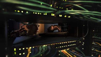 Airman 1st Class Thomas Schoening, a Cyber Transport Systems airman, poses for a photograph in the server room at the 153d Airlift Wing, Wyoming Air National Guard Base, Cheyenne, Wyo., Nov. 1, 2019. (U.S. Air National Guard photo by Staff Sgt. Jon Alderman)