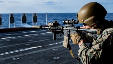PHILIPPINE SEA (April 3, 2020) A Marine with Battalion Landing Team, 1st Battalion, 5th Marines, 31st Marine Expeditionary Unit (MEU), fires his M4A1 service rifle during a combat marksmanship range aboard amphibious assault ship USS America (LHA 6). Deck shoots allow Marines to get hands on training with their rifles to ensure that they stay proficient and lethal with their weapon systems. America, flagship of the America Expeditionary Strike Group, 31st MEU team, is operating in the U.S. 7th Fleet area of operations to enhance interoperability with allies and partners and serve as a ready response force to defend peace and stability in the Indo-Pacific region. (U.S. Marine Corps photo by Lance Cpl. Kolby Leger)