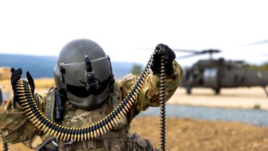 A U.S. Army Soldier, assigned to 3-501st Assault Helicopter Battalion, Combat Aviation Brigade, 1st Armored Division, prepares 7.62mm ammunition for an aerial gunnery exercise from a UH-60 Black Hawk helicopter at Novo Selo Training Area, Bulgaria on Aug. 23, 2025. 1AD CAB’s aerial gunnery increased lethality and proficiency of all Task Force Iron aviation crews on collective tables while generating warfighting readiness and combat credible forces along NATO’s Eastern Flank. (U.S. Army photo by Capt. Regina Koesters)