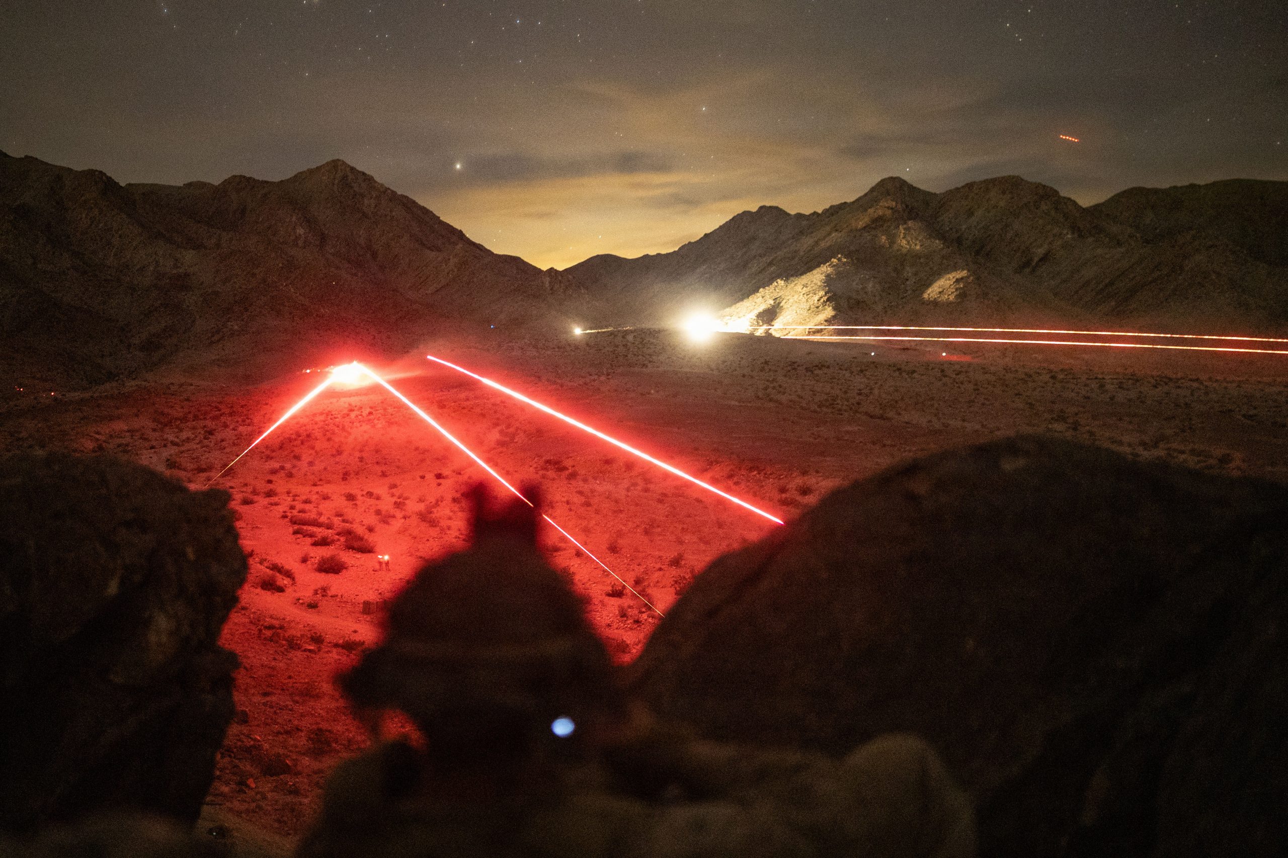 U.S. Marines with 2nd Battalion, 4th Marine Regiment, 1st Marine Division conduct a night live-fire range during Service Level Training Exercise at Marine Corps Air-Ground Combat Center, Twentynine Palms, California, Dec. 17, 2025. SLTE is designed to be a challenging, realistic training environment that produces combat-ready forces capable of operating as an integrated Marine Air Ground Task Force across all domains of military operations. (U.S. Marine Corps photo by Cpl. Christian Cutter)