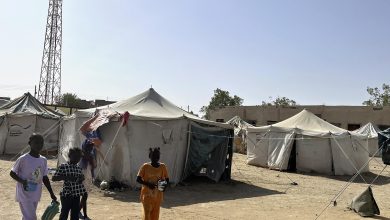 Children head to the washroom at a refugee camp in Port Sudan, eastern Sudan on May 3, 2025.