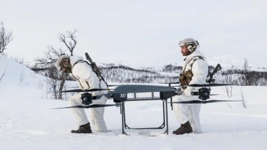Troops moving the T150B drone.