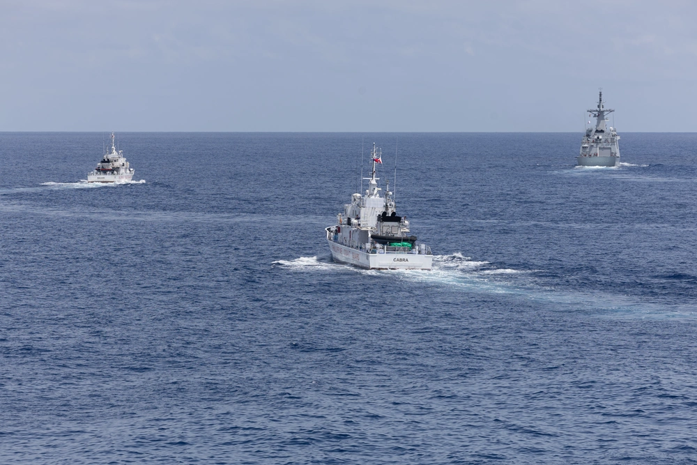 Philippine Coast Guard patrol vessels BRP Suluan and BRP Cabra sail with Philippine Navy frigate BRP Miguel Malvar and USS Curtis Wilbur during a joint maritime activity in the South China Sea, July 16, 2025.