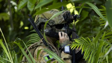 Australian Army officer Major Patrick Hoare from the 1st Battalion, The Royal Australian Regiment, radios information during an urban clearance of the Situm primary school as part of Exercise Wantok Warrior 25 in Lae, Papua New Guinea, on 18 October 2025. *** Local Caption *** Exercise Wantok Warrior is an annual training exercise held between the Australian Army and Papua New Guinea Defence Force in PNG. In 2025, around 300 soldiers conducted the exercise in Lae, completing infantry focused scenarios which include air-mobile and amphibious serials to enhance their skills and interoperability in a complex tactical setting. Exercise Wantok Warrior is a longstanding exercise and continues to build shared understanding, professionalism, and deepen the military relationship between both nations.
