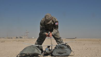 Senior Airman James McGaha, 379th Expeditionary Security Force Squadron patrolman, prepares the Raven B Digital Data Link drone, a small unmanned aircraft or drone, for flight Feb. 19 at Al Udeid Air Base, Qatar. McGaha checks the drone’s wires and connections to ensure components are operational before flight. (U.S. Air Force photo by Tech. Sgt. Terrica Y. Jones/Released)