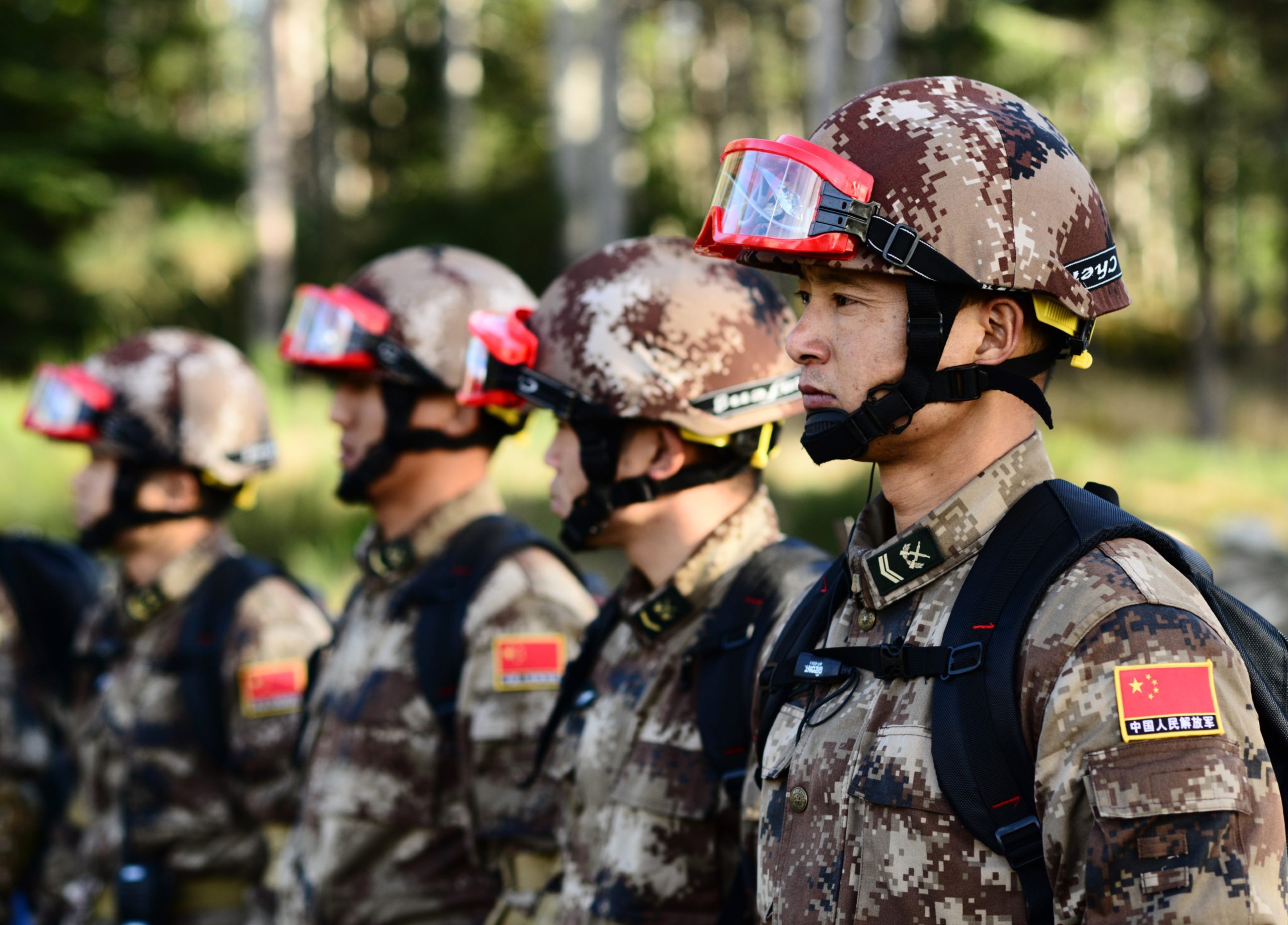 Soldiers from the People’s Liberation Army (PLA) listen to a briefing in preparation for a search and extraction exchange during the 13th annual U.S.-China Disaster Management Exchange at Camp Rilea Armed Forces Training Center, November 17, 2017, in Warrenton, Ore. U.S. Army Pacific hosts the annual exchange with the PLA to foster mutual trust and understanding while sharing lessons learned to increase disaster response capabilities in the Pacific region. (Photo by Sgt. 1st Class April Davis, Oregon Military Department Public Affairs)