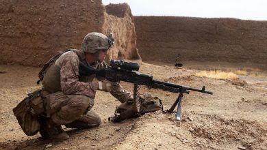 A soldier provides security with an M240B medium machine gun during a mission in Afghanistan.