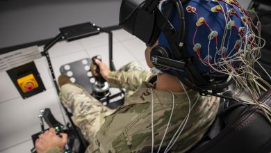 Master Sgt. Bradley Blair, senior enlisted leader, U.S. Air Force School of Aerospace Medicine, or USAFSAM, Office of the Dean, completes an exercise in a T-6A Texan II virtual reality flight simulator while wearing a cap that measures brain activity after applying a cervical transcutaneous vagus nerve stimulation, or ctVNS, device to his neck during a test at the Human Universal Measurement and Assessment Network Laboratory at Wright-Patterson Air Force Base, Ohio, May 19, 2023. Researchers with the Air Force Research Laboratory, or AFRL, Human Effectiveness Directorate developed a military-grade ctVNS device to enhance cognitive performance in Airmen and Guardians, specifically to accelerate training, mitigate fatigue and enable decision superiority. USAFSAM and the Human Effectiveness Directorate are two mission units that comprise AFRL’s 711th Human Performance Wing. (U.S. Air Force photo / Richard Eldridge)