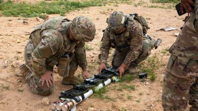 U.S. Army Soldiers assigned to Task Force Redleg add blocks of C4 explosives to rocket motors to create a demolition shot in preparation for a controlled detonation exercise near Al Asad Air Base, Iraq, March 19, 2025. The purpose of the range was to destroy unserviceable munitions to reduce risk allowing the Coalition to better support future operations. These skill sets allow Coalition members to be effective force multipliers by mentoring and developing partner force capabilities to defeat ISIS and maintain regional security and stability. (U.S. Army photo by Sgt. Ryan Ahmed)