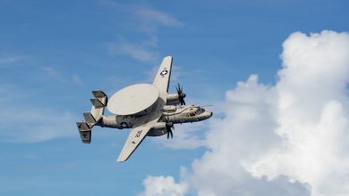 E-2D Hawkeye, attached to Airborne Command and Control Squadron (VAW) 125, flies over Nimitz-class aircraft carrier USS George Washington