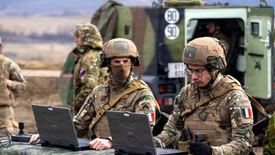 French Armed Forces Soldiers monitor the observation point during a live fire exercise of the CAESAR howitzer