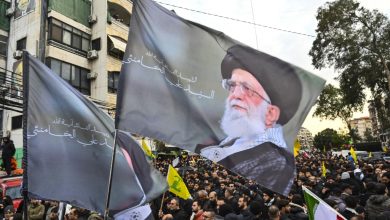 People hold picture of Iran's former Supreme Leader, Ayatollah Ali Khamenei, while crying at an event honoring Iran's former Supreme Leader, Ayatollah Ali Khamenei, on March 1, 2026 at Ashoura Square in southern Beirut, Lebanon.