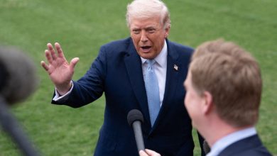 US President Donald Trump speaks to members of the media on the South Lawn of the White House before boarding Marine One for a trip to Florida in Washington, D.C., on March 20, 2026.
