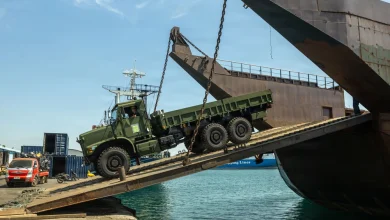 US Marines and Philippine contractors load a Medium Tactical Vehicle Replacement onto a barge in Cagayan de Oro, Philippines in support of Exercise Balikatan 2026.