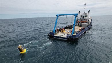 A boat towing the SeaPicket undersea surveillance system