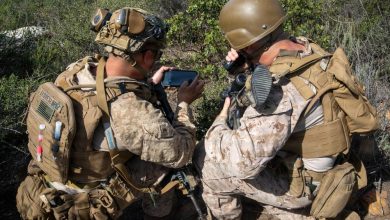 Two soldiers use a Defense Advanced Global Positioning System Receiver.