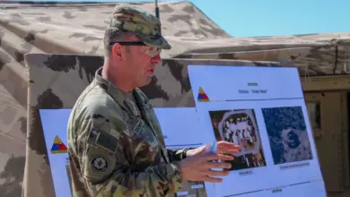 A US Army general briefs personnel during a Project Convergence CJADC2 demonstration at Fort Irwin.
