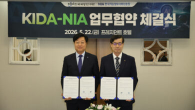 Officials from the Korea Institute for Defense Analyses (KIDA) and the National Information Society Agency (NIA) pose after signing an agreement to coordinate national and defense AI initiatives in Seoul on May 22, 2026. Photo: Korea Institute for Defense Analyses