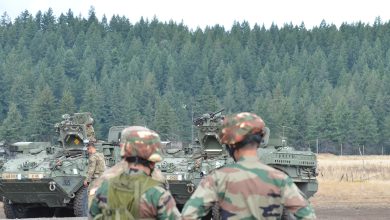 U.S. Army Soldiers from 1-2 Stryker Brigade Combat Team and Indian Army Soldiers examine a Stryker vehicle during exercise Yudh Abhyas 19 at Joint Base Lewis-McChord. (U.S. Army photo by Staff Sgt. Joseph Tolliver, 1-2 Stryker Brigade Combat Team.)
