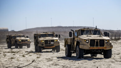 U.S. Marines drive Joint Light Tactical Vehicles at White Beach as part of the I Marine Expeditionary Force JLTV Operator New Equipment Training course on Marine Corps Base Camp Pendleton, California, Oct. 24, 2019. The beach training teaches Marines how to operate JLTVs on different types of terrain. The JLTV OPNET course is an eight-day training evolution teaching students the vehicle’s characteristics, operations, operator maintenance and safety. (U.S. Marine Corps photo by Lance Cpl. Drake Nickels)