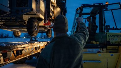 U.S. Air Force Senior Airman Jakob Smith, 773d Logistics Readiness Squadron ground transportation support operator, guides a forklift during a Prepositioned Warfighting Materiel movement at Joint Base Elmendorf-Richardson, Alaska, Jan. 15, 2026. The movement of PWM revamps Pacific Air Command's ability to rapidly generate airpower and provides the theater with enhanced infrastructure, robust material maintenance, and advanced command, control, communications, computers, and intelligence capabilities. (U.S. Air Force photo by Senior Airman Hunter Hites)