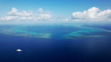 An aerial drone photo taken on May 12, 2026 shows the China Coast Guard vessel Chuanshan patrolling in the territorial waters of China's Huangyan Dao in the South China Sea.