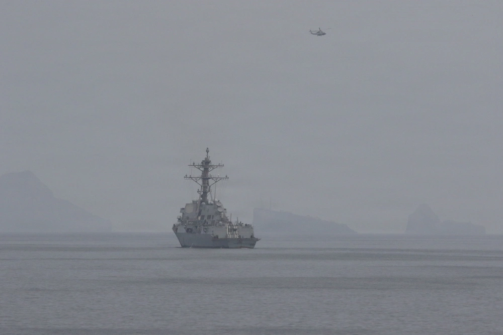A U.S. Navy guided-missile destroyer sails in the Strait of Hormuz during mine clearance operations.