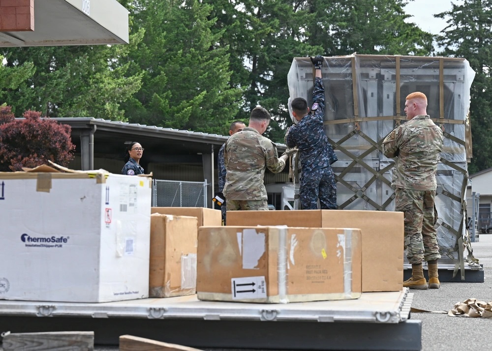 Service members prepare cargo during Enduring Partners 2026 at Camp Murray, Washington, June 4, 2026. The exercise included logistics and humanitarian assistance activities between US and Royal Thai Air Force personnel. Photo: Master Sgt. Brandy Burke/DVIDS