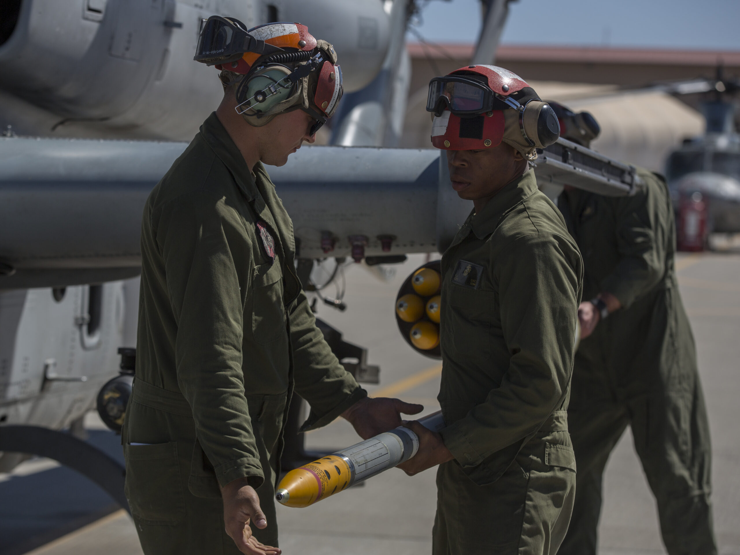 U.S. Marines assigned to Marine Aviation Weapons and Tactics Squadron 1 load a 2.75-inch rocket configured with Advanced Precision Kill Weapon System II, a hydra 70 rocket motor and M282 High Explosive Incendiary Multipurpose Penetrator Warhead onto an AH-1Z Viper during a APKWS loading and flight takeoff exercise in support of Weapons and Tactics Instructor course 2-18 at Marine Corps Air Station Yuma, Ariz., March 29. WTI is a seven-week training event hosted by MAWTS-1 cadre, which emphasizes operational integration of the six functions of Marine Corps aviation in support of a Marine Air Ground Task Force and provides standardized advanced tactical training and certification of unit instructor qualifications to support Marine Aviation Training and Readiness and assists in developing and employing aviation weapons and tactics. (U.S. Marine Corps photo by Lance Cpl. Ashley McLaughlin/Released)