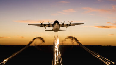A C-130 from the 153rd Airlift Wing, Wyoming Air National Guard, fires off flares over Camp Guernsey Joint Training Center during a training mission on Sept. 24, 2019. The 153rd Airlift Wing's primary mission is to provide combat airlift to our state and nation. (U.S. Air National Guard photo by Staff Sgt. Jon Alderman)