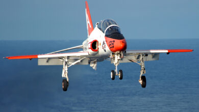 A T-45C Goshawk prepares to land on the flight deck of aircraft carrier USS Dwight D. Eisenhower. The Navy uses the T-45 to train new pilots for carrier-based operations.