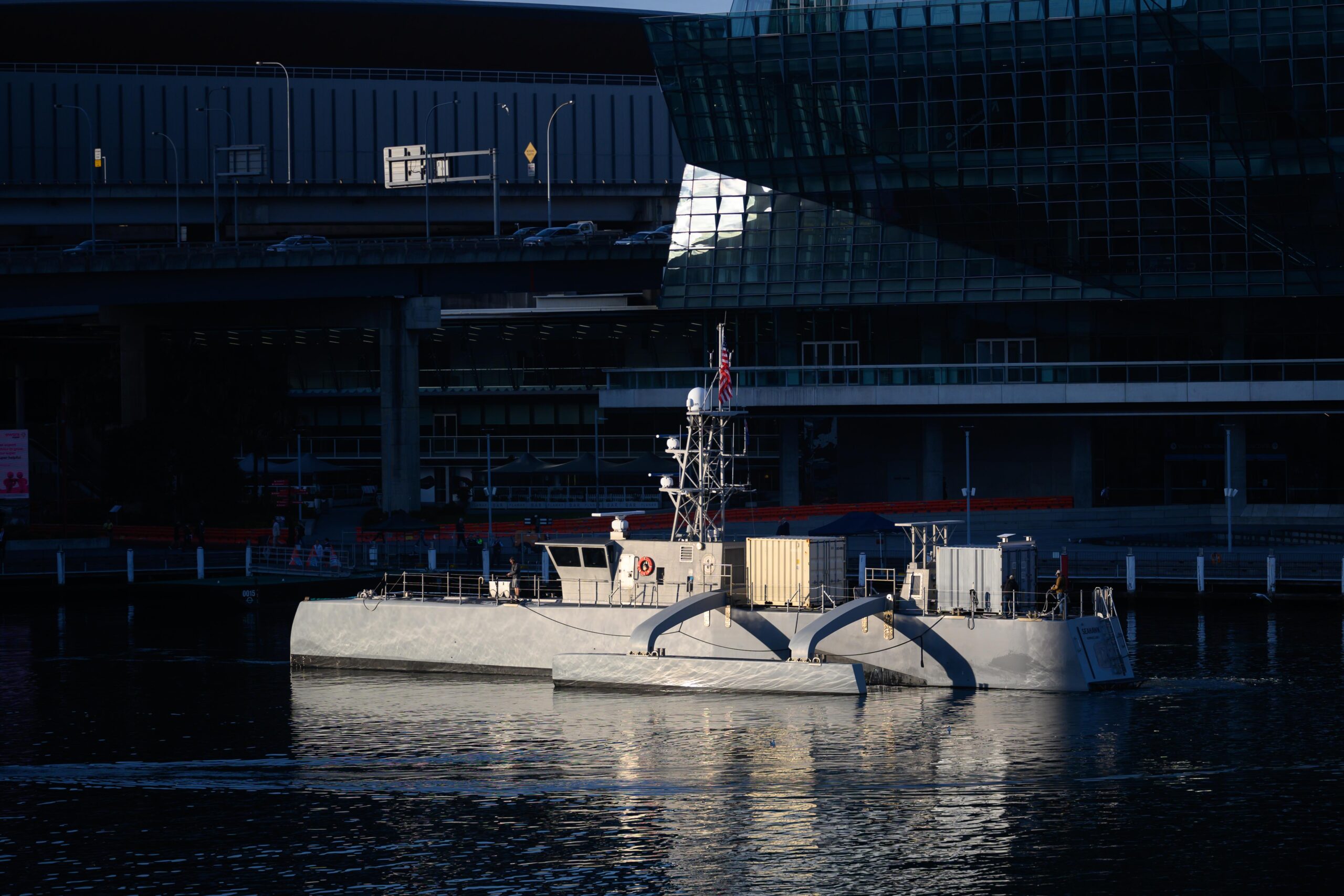The unmanned surface vessel Seahawk sits pierside outside of The International Convention Centre Sydney during Integrated Battle Problem (IBP) 23.2, Nov 8, 2023. IBP 23.2 is a Pacific Fleet exercise to test, develop and evaluate the integration of unmanned platforms into fleet operations to create warfighting advantages. (U.S. Navy photo by Mass Communication Specialist 2nd Class Jesse Monford)