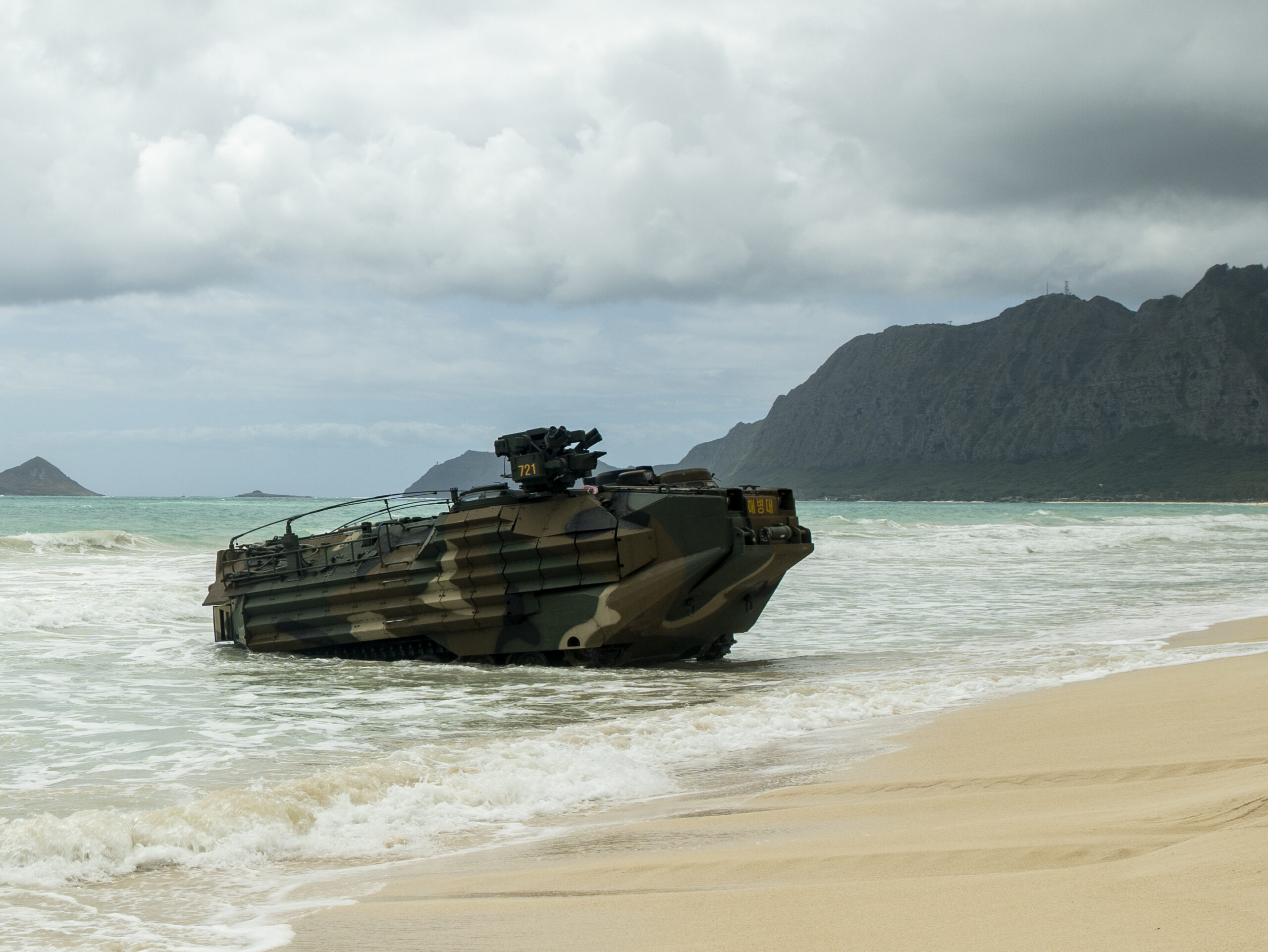 A Republic of Korea amphibious assault vehicle tests its water-tight seals at Marine Corps Training Area Bellows, Waimanalo, Hawaii, during Exercise Rim of the Pacific 2024, July 14. Twenty-nine nations, 40 surface ships, three submarines, 14 national land forces, more than 150 aircraft, and 25,000 personnel are participating in and around the Hawaiian Islands June 27 to Aug. 1. The world's largest international maritime exercise; RIMPAC provides a unique training opportunity while fostering and sustaining cooperative relationships among participants critical to ensuring the safety of sea lanes and security on the world's oceans. RIMPAC 2024 is the 29th exercise in the series that began in 1971. (U.S. Marine Corps photo by Sgt. Patrick Katz)