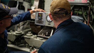 Machinist’s Mate (Auxiliary) 2nd Class James Wofford, assigned to Pearl Harbor Naval Shipyard and Intermediate Maintenance Facility, right, and Machinist’s Mate (Auxiliary) 2nd Class Logan Kaiser, assigned to Los Angeles-class fast-attack submarine USS Toledo (SSN 769), monitor gauge readings aboard Toledo at Joint Base Pearl Harbor-Hickam, Hawaii, Sept. 18, 2025.