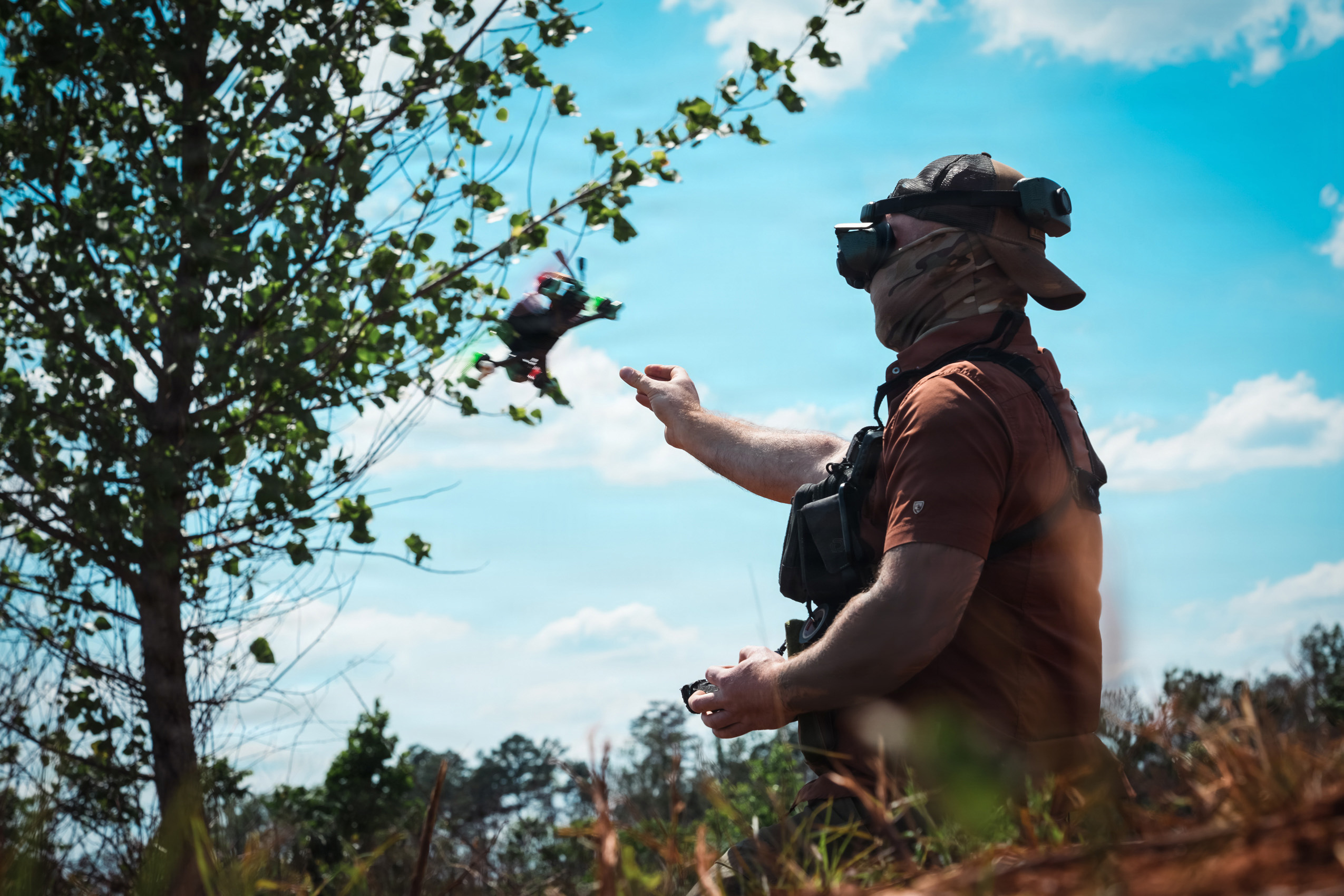 An Unmanned Aerial Vehicle (UAV) drone operator assigned to 1st Special Forces Command (Airborne) releases a UAV for a flight demonstration at a counter- drone range in Ellerbe, North Carolina, May 5, 2026. UAVs are flown using First Person View (FPV) goggles to see real-time, immersive video feed from the drone's internal camera. This photo has been altered to protect the identity of the operator. (U.S. Army photo by Ssg. Gabriel E. Davis)