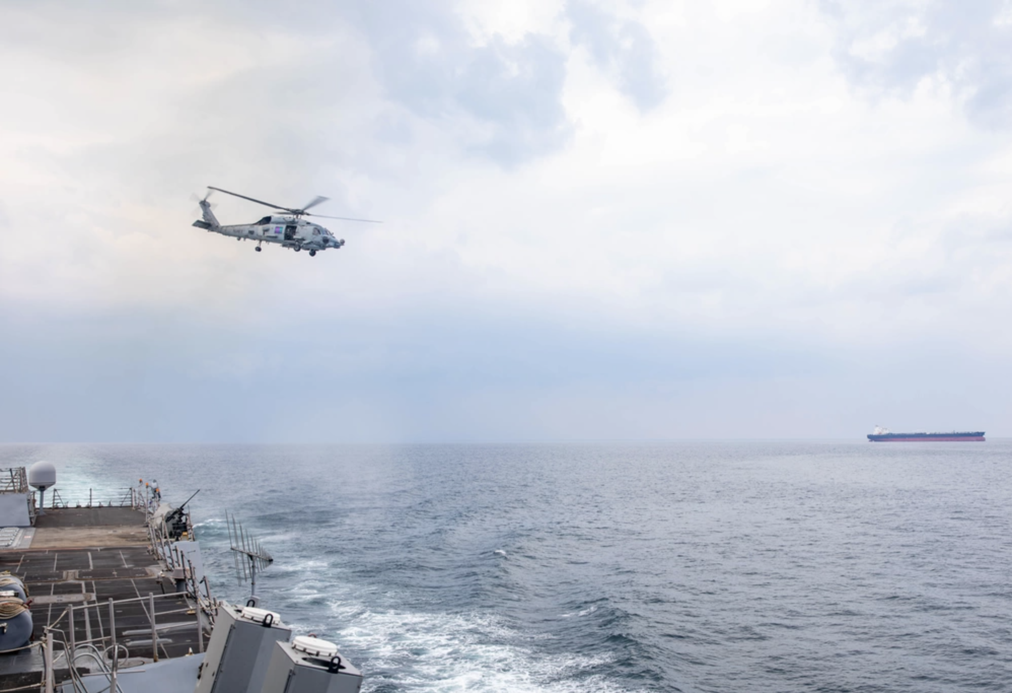 An MH-60R Sea Hawk helicopter launches from the guided-missile destroyer USS Gravely while transiting the Strait of Hormuz on Jan. 18, 2024. The US military said it struck multiple Iranian military targets near the strategic waterway on June 27, 2026, following an alleged attack on a commercial tanker.
