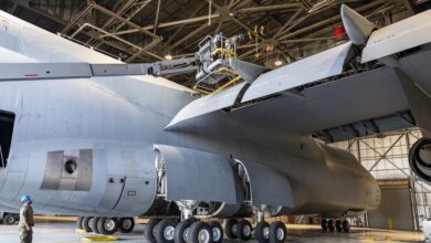 US Air Force maintainers inspect the wing of a C-5M Super Galaxy during routine maintenance at Travis Air Force Base, California. Photo: Heide Couch/DVIDS