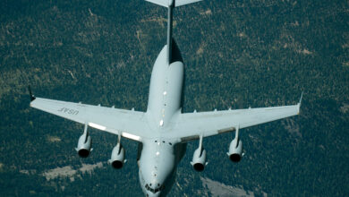 A C-17 Globemaster III from the 301st Airlift Squadron, 349th Air Mobility Wing, Travis Air Force Base, Calif., is refueled by a KC-10 Extender,