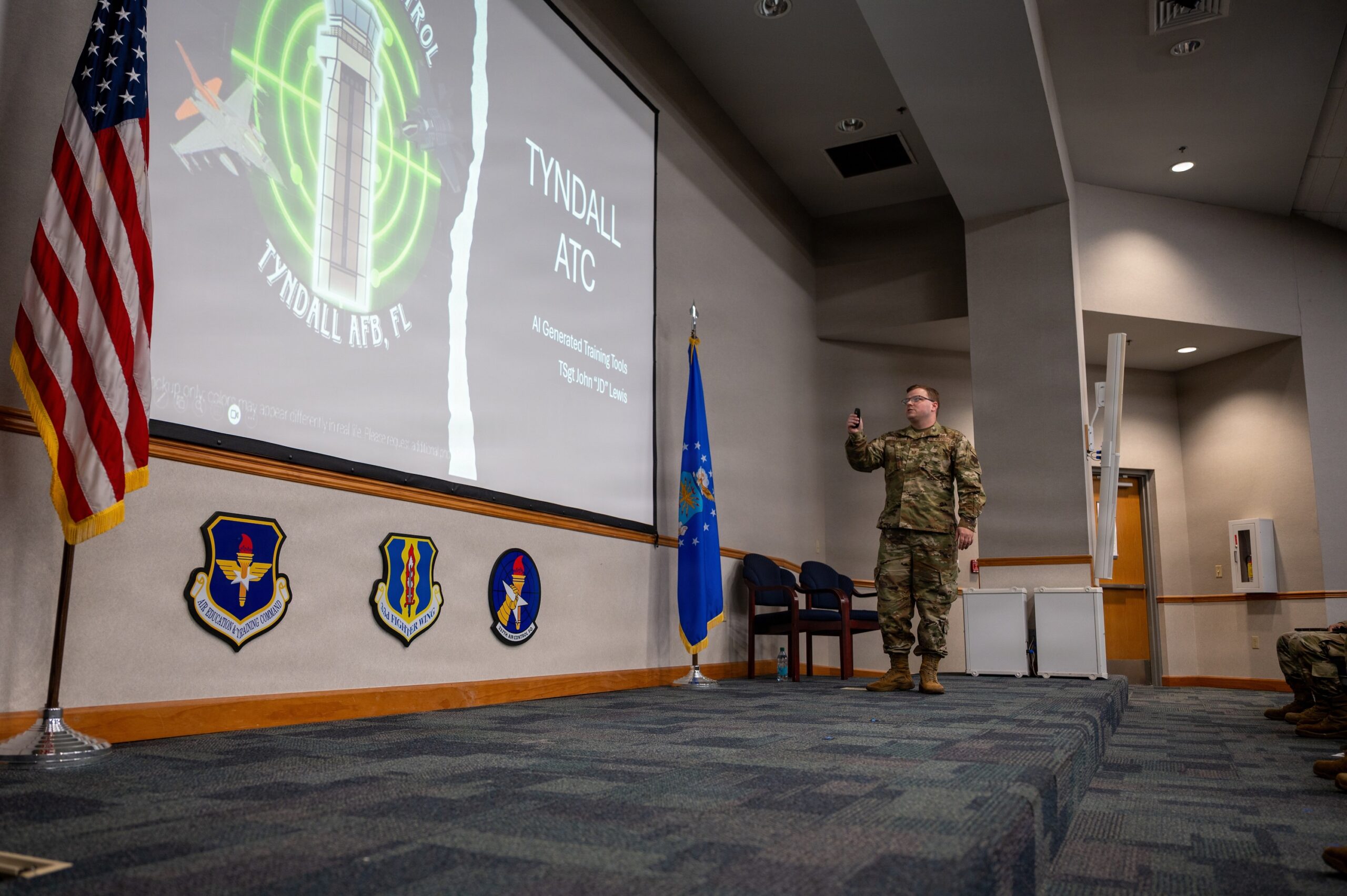 A US Air Force airman presents an AI-generated training tool during the Artificial Intelligence and Automation Showcase at Tyndall Air Force Base, Florida, on June 17, 2026. Photo: Airman 1st Class Courtney McCants/US Air Force
