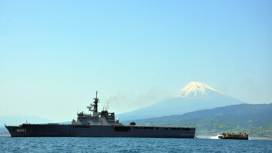 The lead Ōsumi-class landing ship LST 4001 followed by a Landing Craft Air Cushion
