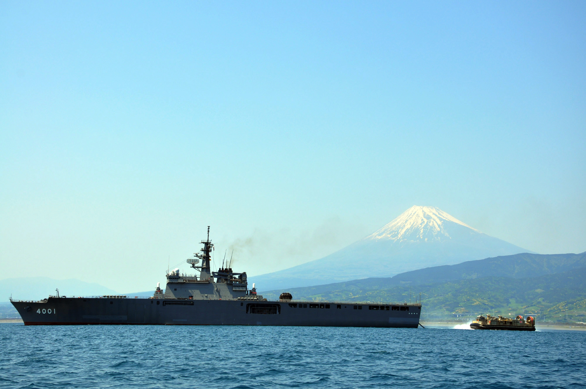 The lead Ōsumi-class landing ship LST 4001 followed by a Landing Craft Air Cushion