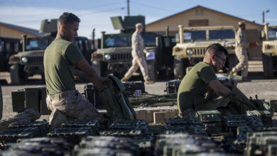 U.S. Marine Corps Lance Cpl. Edson M. Rangelcano, left, and Lance Cpl. Nathan-Zachary M. Decena, both field radio operators assigned to Bravo Battery, 2nd Low Altitude Air Defense (LAAD) Battalion inspect gear during a gear inventory at the National Training Center (NTC) in Fort Irwin, Calif., Jan. 7, 2018. NTC 18-03 is a simulated combat training exercise in which Marines with 2nd LAAD conducted Ground Based Air Defense in defense of Soldiers with 1st Squadron, 11th Armored Cavalry Regiment. (U.S. Marine Corps photo by Cpl. Koby I. Saunders)